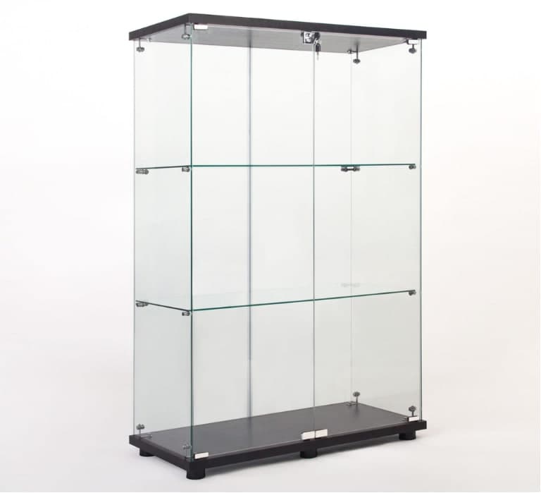 Glass tower showcase with two locking doors and glass shelves on a black base
